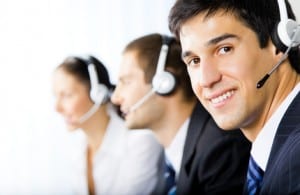 Three support phone operators at workplace